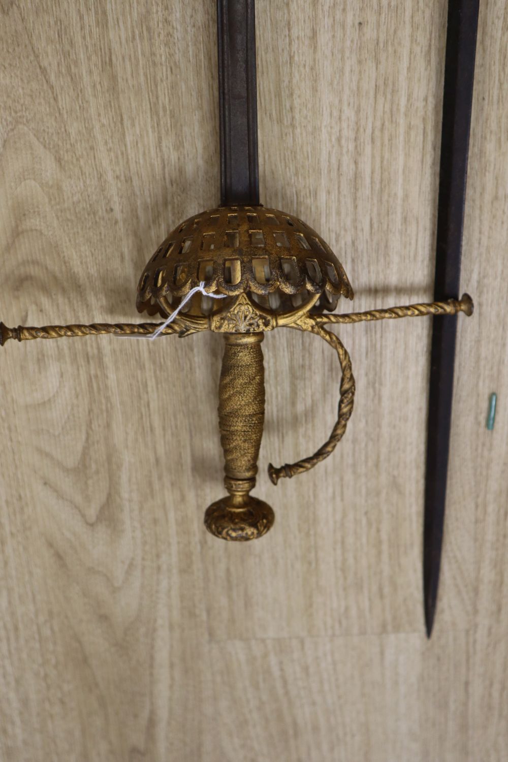 A pair of duelling swords, with cast hilts and 35 inch blades